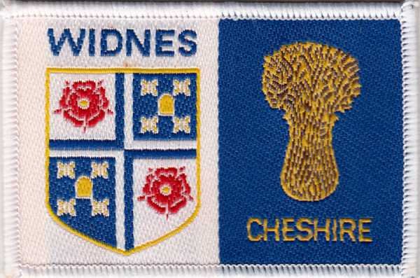 [Widnes @ District Badge]
