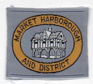 [Market Harborough & District District Badge]