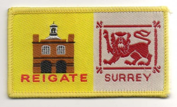 [Reigate @ District Badge]